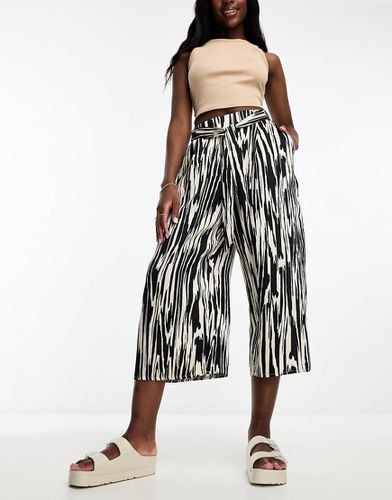 Jupe-culotte imprimée avec lien noué à la taille - Noir et - River Island - Modalova