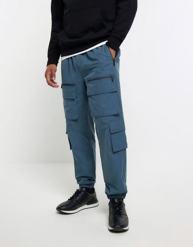 Pantalon cargo à poches - River Island - Modalova