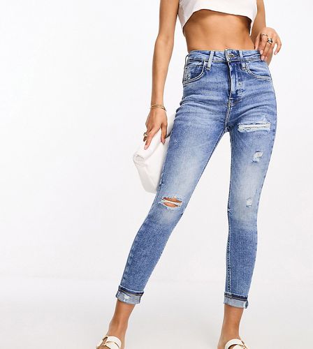 Jean skinny effet sculptant à taille haute et genoux déchirés - moyen délavé - River Island Petite - Modalova