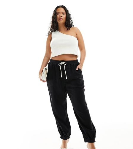 Pantalon en jersey resserré aux chevilles - River Island Plus - Modalova