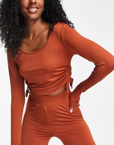Threadbare - Fitness - Crop top d'ensemble de sport froncé et noué sur les côtés - épicé - Threadbare Plus Fitness - Modalova