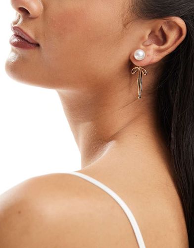 Boucles d'oreilles pendantes avec perles et naud - True Decadence - Modalova