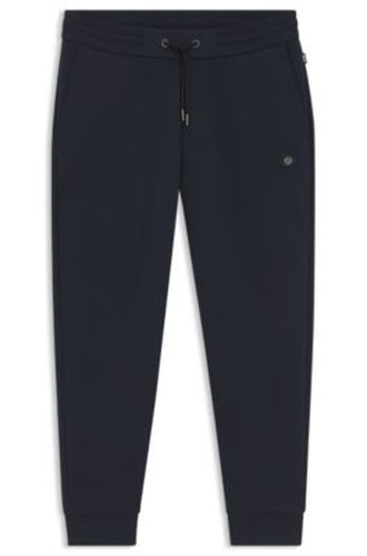 Bas de survêtement en coton mélangé avec écusson monogrammé Double B - Boss - Modalova