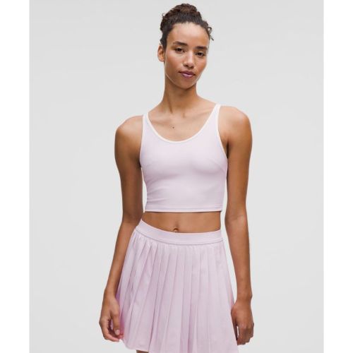 Avantage : un débardeur de tennis pour un bon maintien. Il est fait de tissu extensible et évacuant la sueur et présente une ouverture au dos pour - 156483166 - Modalova