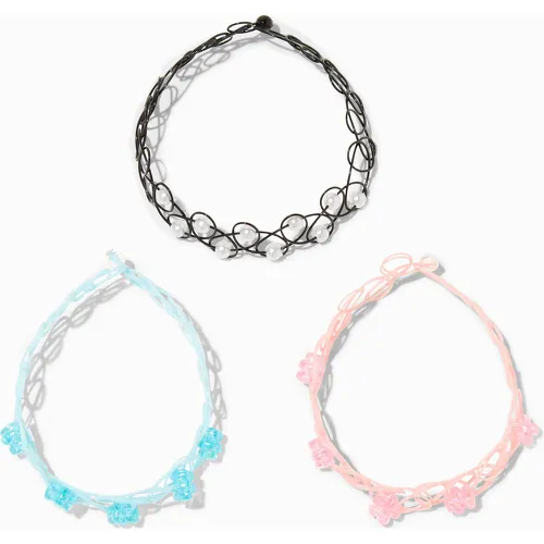 Bracelets élastiques effet tatouage perles d’imitation et fleurs - Lot de 3 - Claire's - Modalova