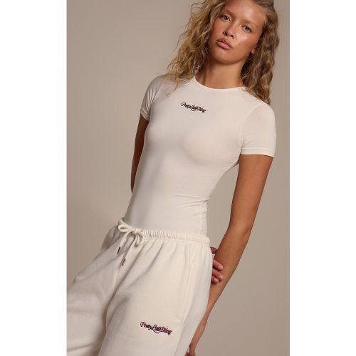 Body à manches courtes et logo "" | Taille Large - PrettyLittleThing - Modalova