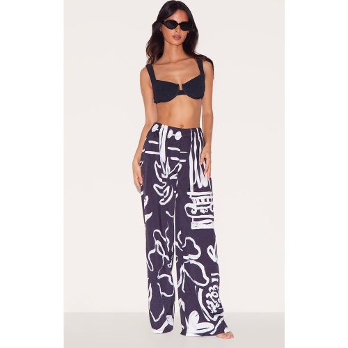 Pantalon de plage en effet lin et blanc fleuri - PrettyLittleThing - Modalova