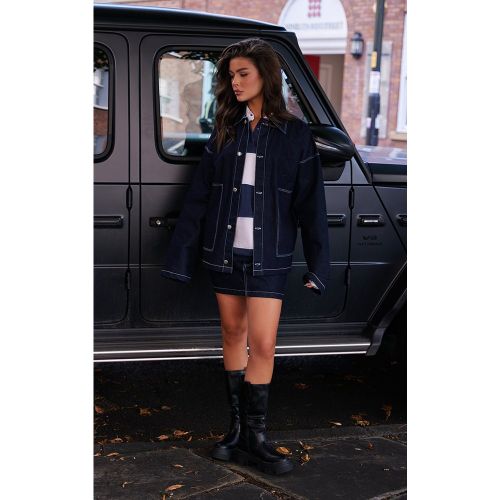 Mini-jupe en jean délavé indigo à coutures contrastantes - PrettyLittleThing - Modalova