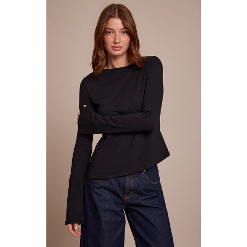Top en coton à manches longues évasées et ourlet asymétrique | Taille 38 - PrettyLittleThing - Modalova