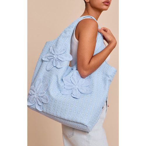Sac de plage cabas floral en raphia bleu - PrettyLittleThing - Modalova