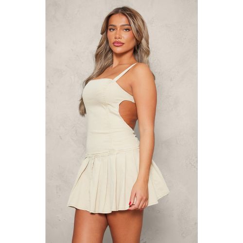 Mini robe à jupe plissée et découpes sur les côtés - PrettyLittleThing - Modalova