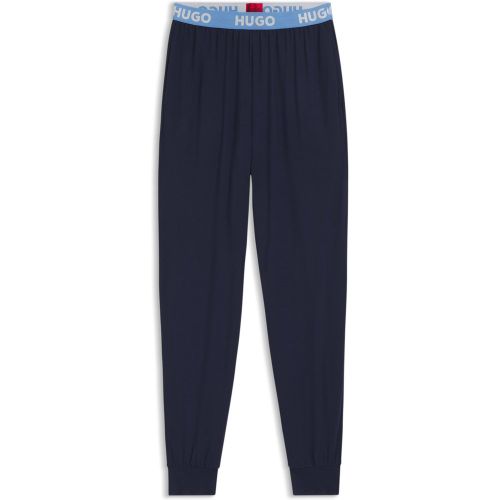 Bas de pyjama en jersey stretch avec taille logotée et chevilles resserrées - HUGO - Modalova