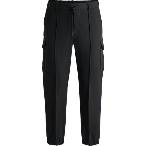 Pantalon cargo en tissu stretch déperlant - Boss - Modalova