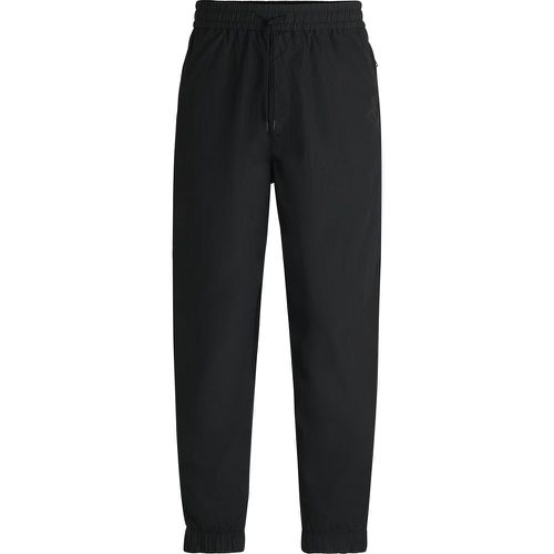 Pantalon Relaxed en tissu léger déperlant - Boss - Modalova