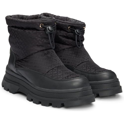 Boots Slim à motif monogramme avec empiècements en cuir - Boss - Modalova