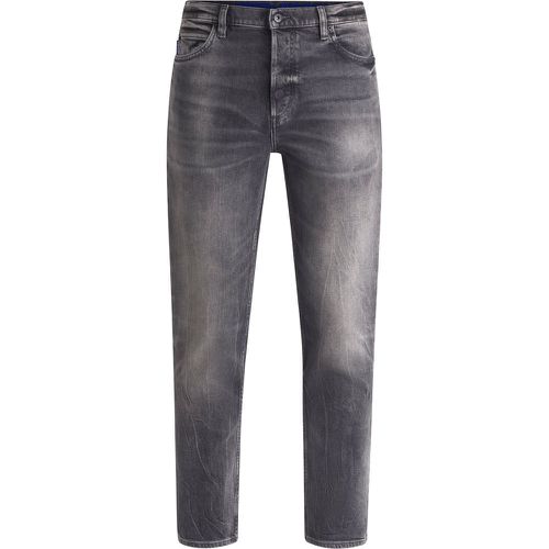 Jean Tapered en denim stretch foncé - HUGO - Modalova