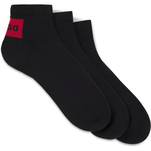 Lot de trois paires de chaussettes basses avec étiquettes logotées rouges - HUGO - Modalova