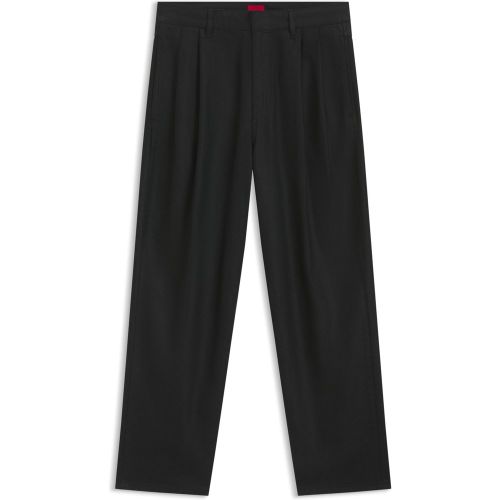 Jean Relaxed en denim ciré noir - HUGO - Modalova