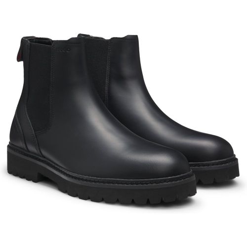 Bottines en cuir à logo embossé - HUGO - Modalova