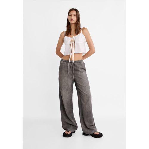 Pantalon large fluide en jean XS - Stradivarius - Modalova