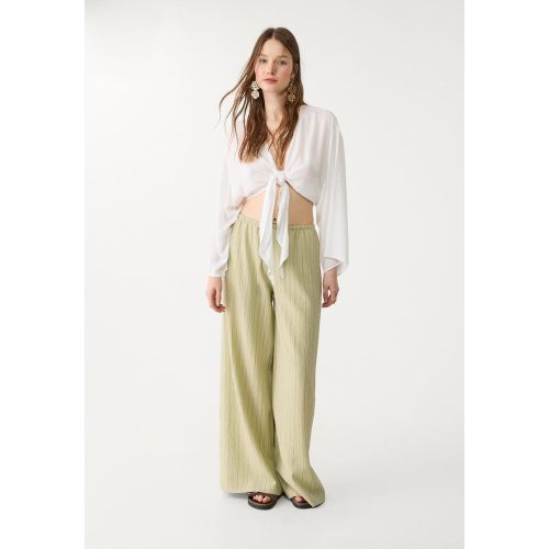 Blouse fluide à nœud XS - Stradivarius - Modalova