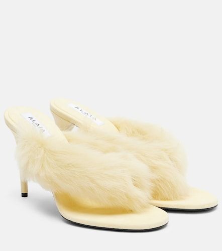 Alaïa Mules en cuir et shearling - Alaia - Modalova