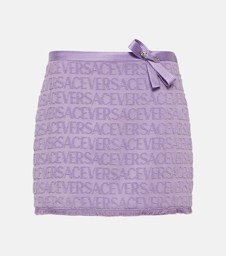 Versace Mini-jupe en coton à logo - Versace - Modalova