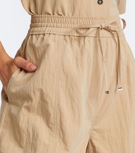 Pantalon ample en coton mélangé à volants - Ganni - Modalova
