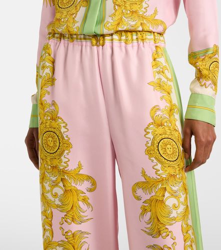 Pantalon ample imprimé en soie - Versace - Modalova