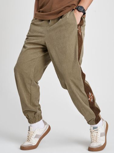 Pantalon long en velours côtelé brodé sur le côtés - ChArmkpR - Modalova